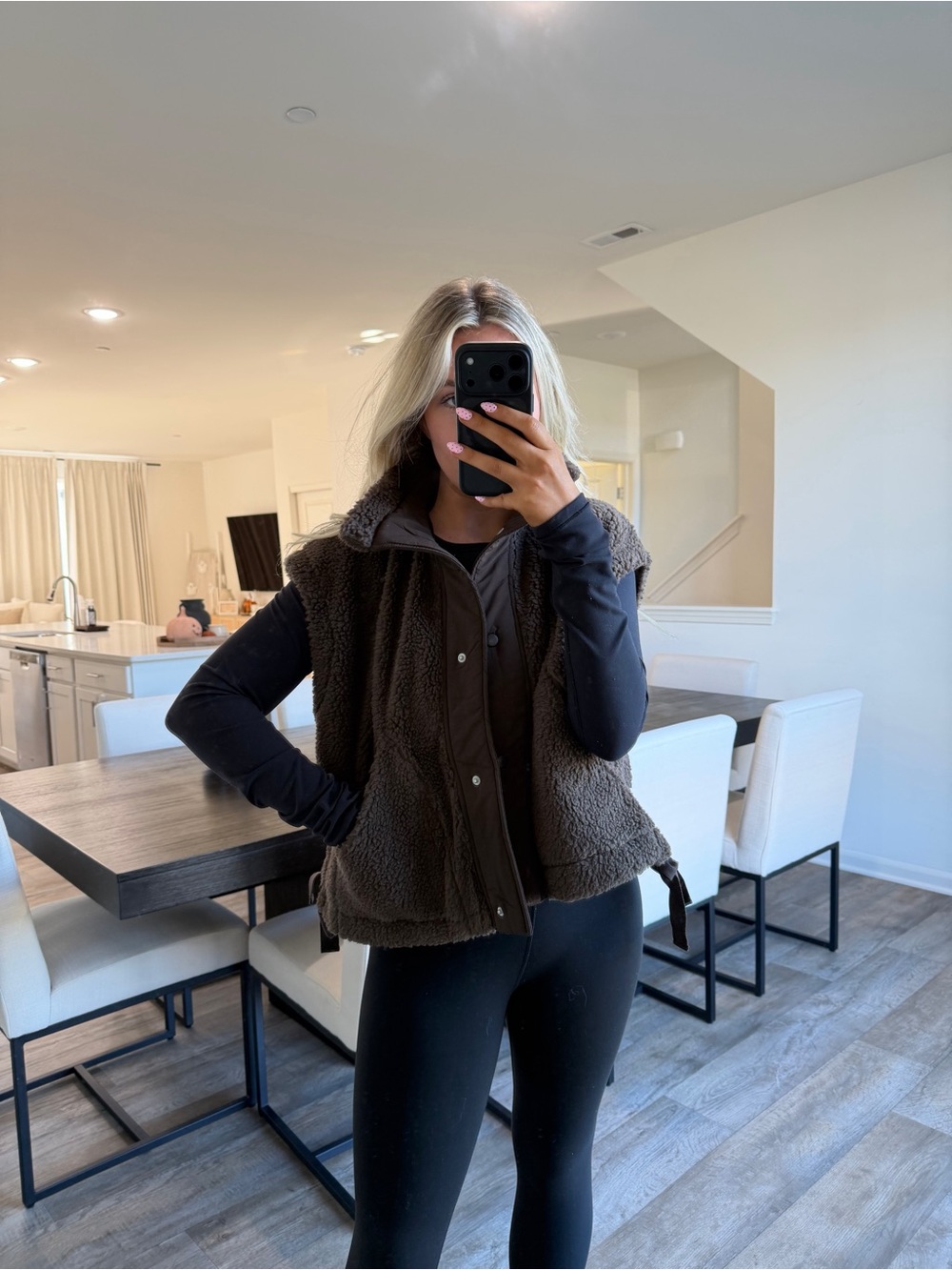 These three brown sherpa vest
